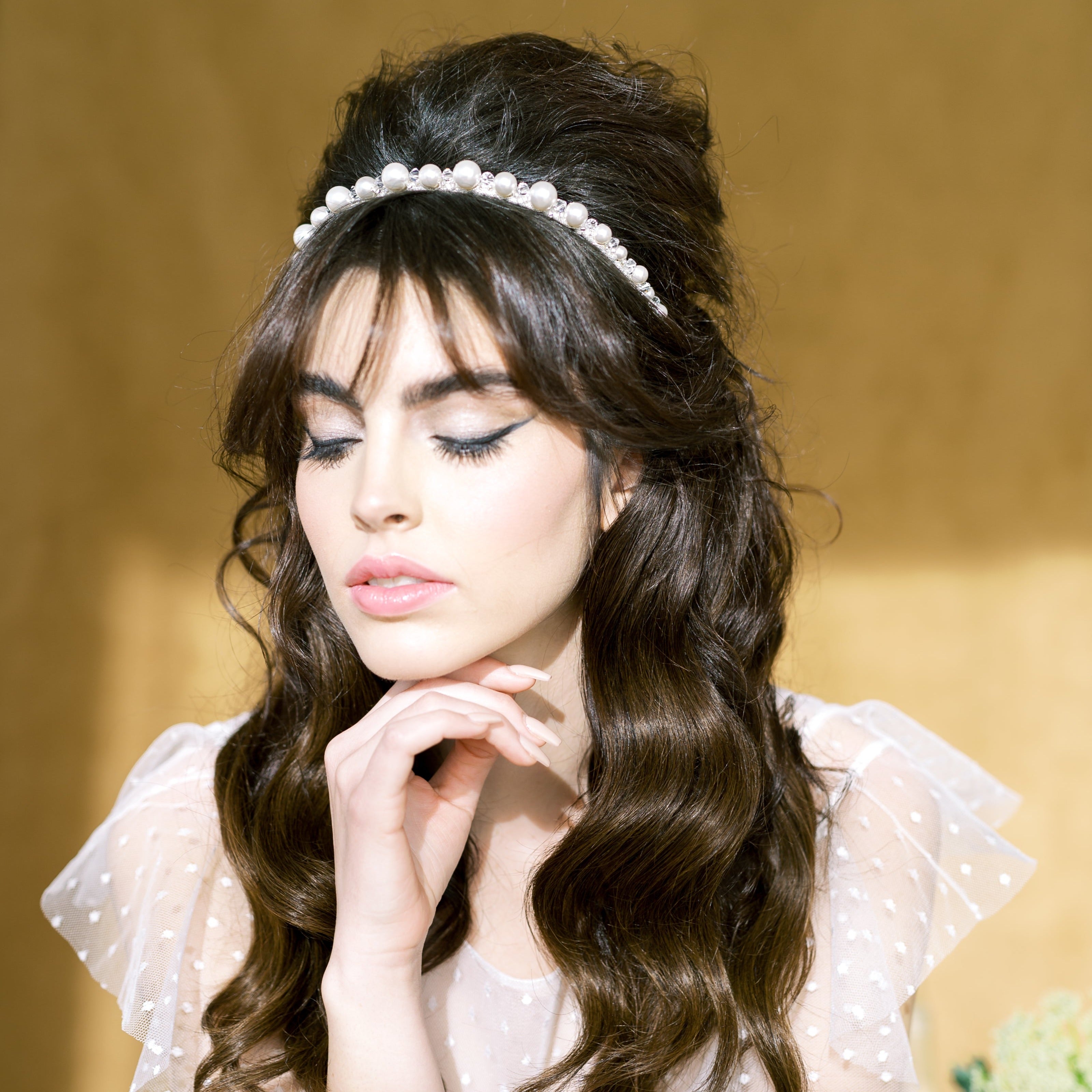 hand wired round glass pearl headband in varying sizes with crystal beads and seed beads throughout. Hand stitched to a metallic ribbon wrapped headband. Available in silver, gold and rose gold with white or ivory pearls and clear or AB crystals. Handmade in Toronto Canada by Blair Nadeau Bridal Adornments